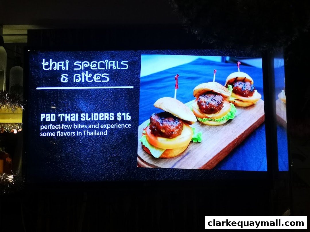 A digital display showcasing Pad Thai Sliders with a description and price.
