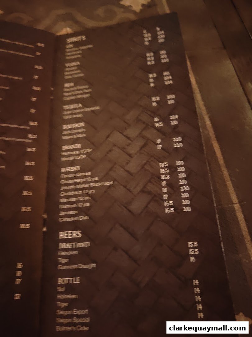 A menu with various spirits, beers, and bottles with prices.