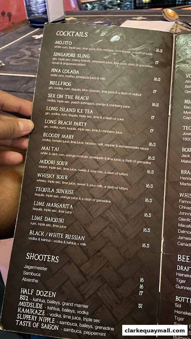 A menu featuring cocktails and shooters with prices.