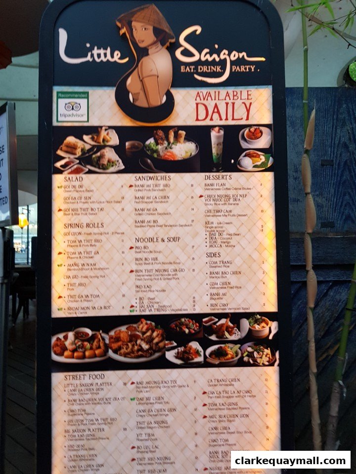 A menu board for Little Saigon restaurant featuring various Vietnamese dishes and drinks.
