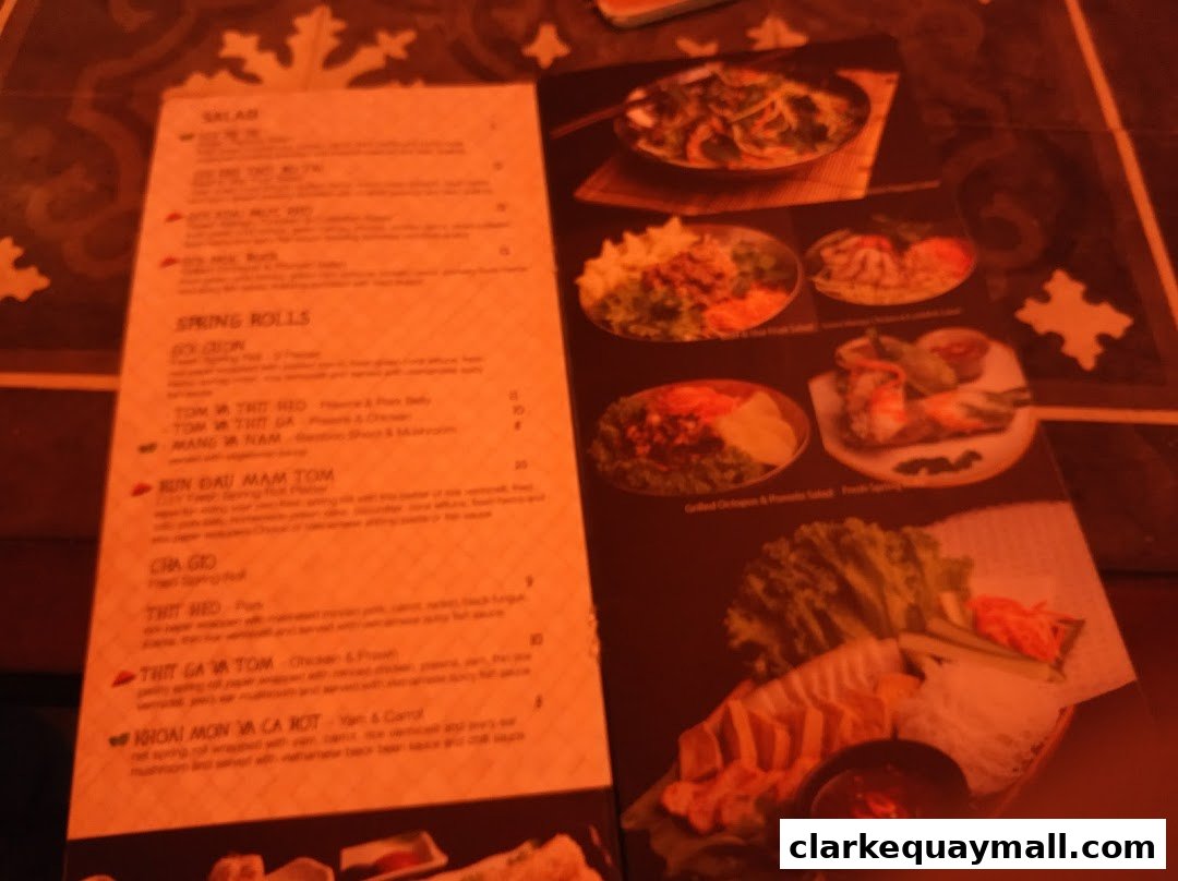 A menu from Little Saigon featuring Vietnamese dishes like spring rolls and salads.
