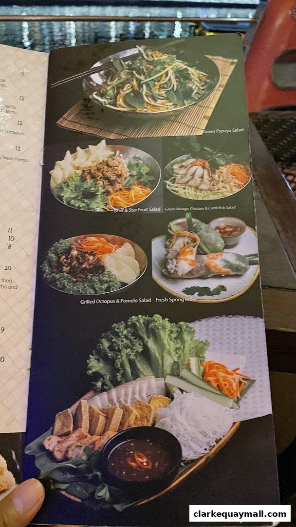 A menu page from Little Saigon featuring various Vietnamese dishes with appealing food photography.