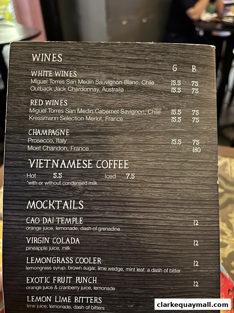 A menu featuring wines, Vietnamese coffee, and mocktails with prices.