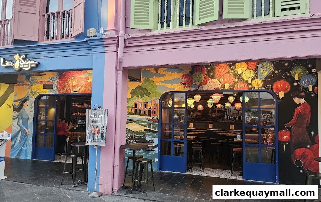 The colorful exterior of Little Saigon restaurant with vibrant murals and inviting seating.