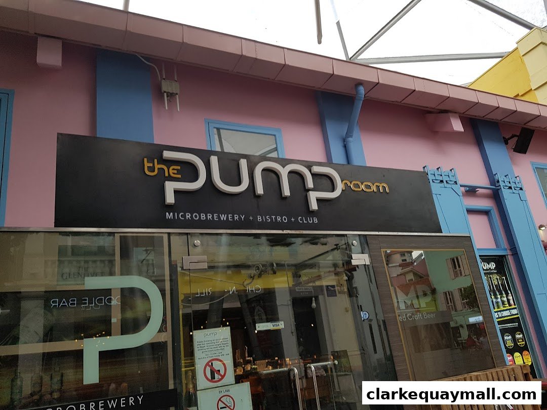 The exterior of 'The Pump Room' microbrewery, bistro, and club with a prominent sign.
