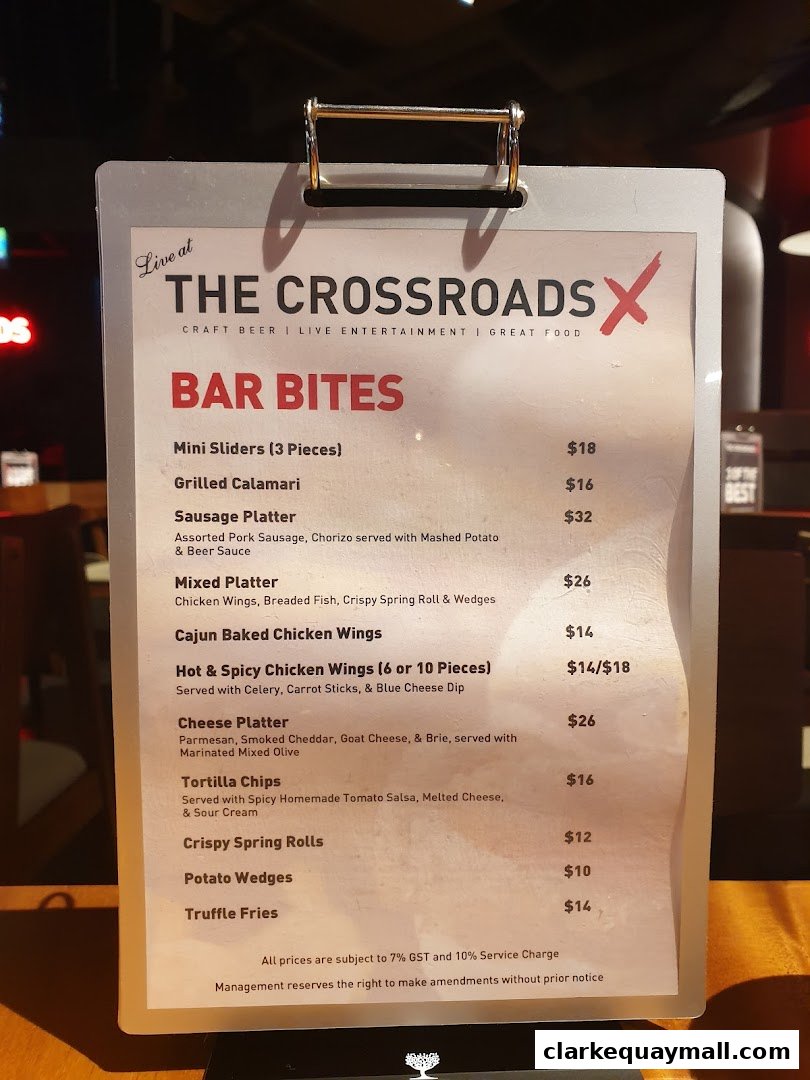 A menu for 'Live at The Crossroads' featuring 'Bar Bites' with various food items and prices.