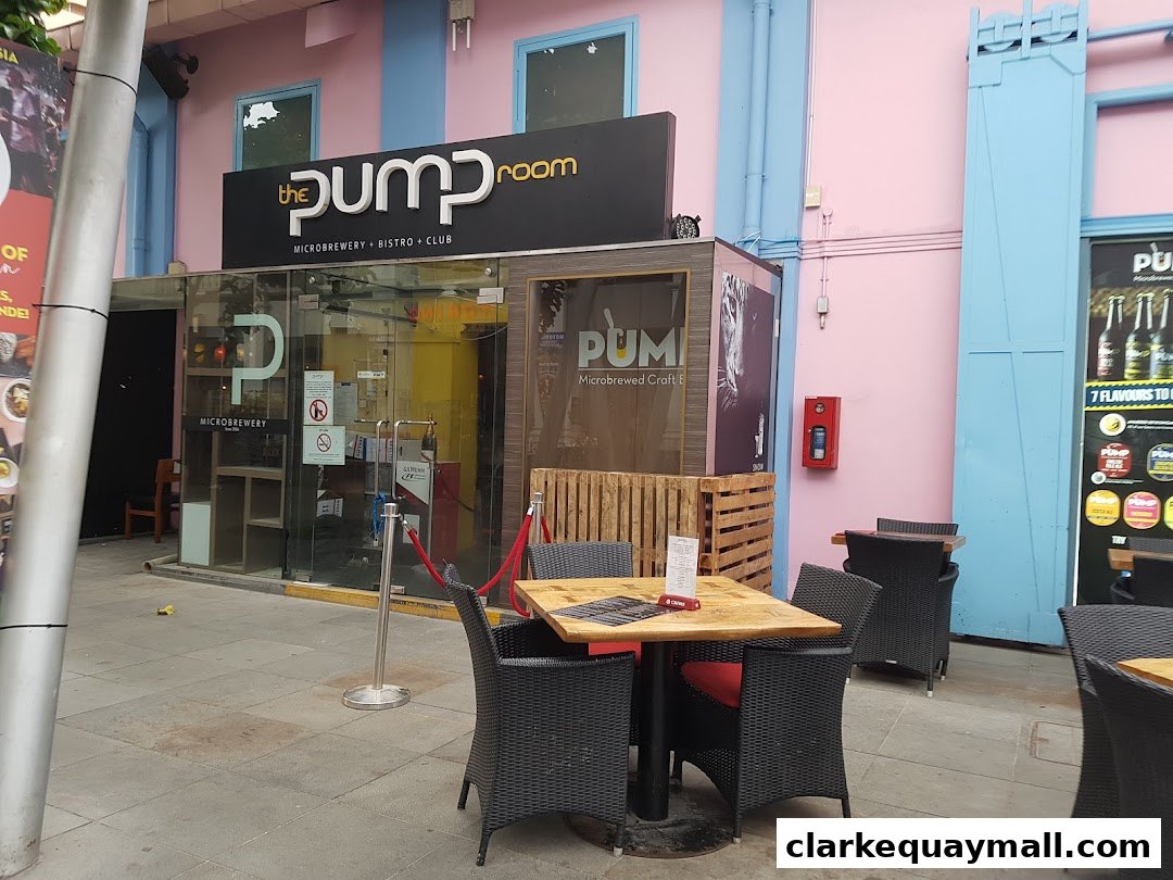 The Pump Room microbrewery, bistro, and club storefront with outdoor seating.