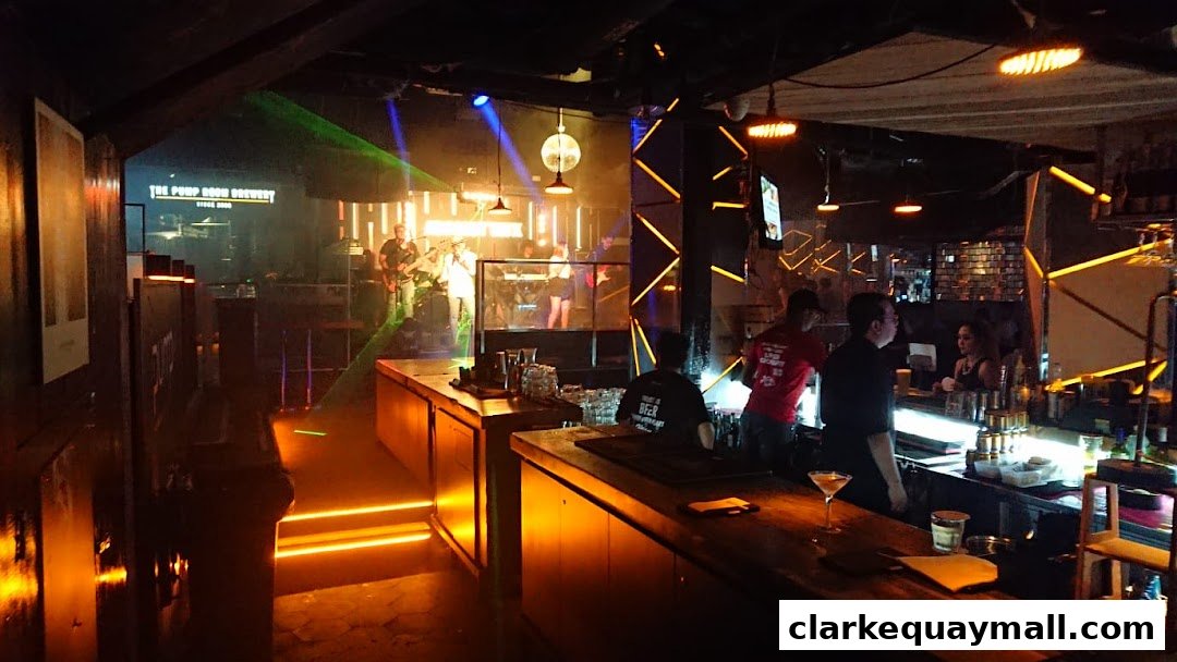 A lively bar scene with a live band performing on stage and bartenders serving drinks.