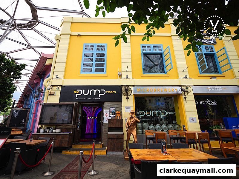 Exterior of The Pump Room, a microbrewery, bistro, and club, with outdoor seating.