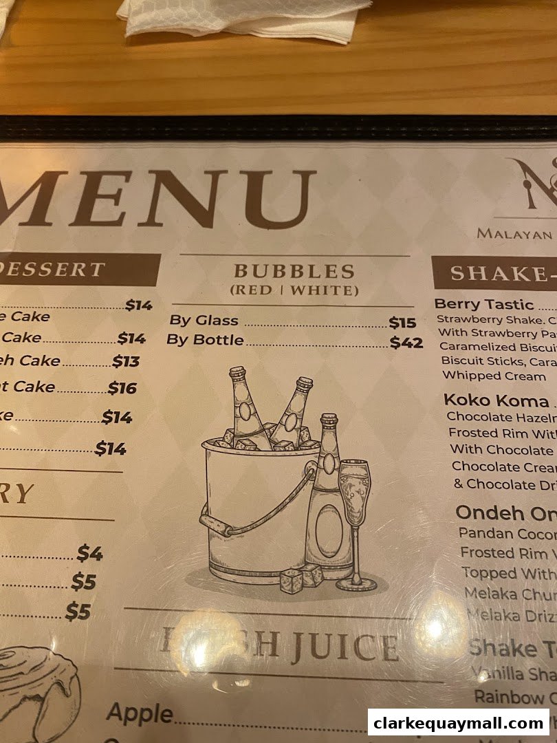 A menu from Malayan Settlement featuring desserts, bubbles, shakes, and juices.