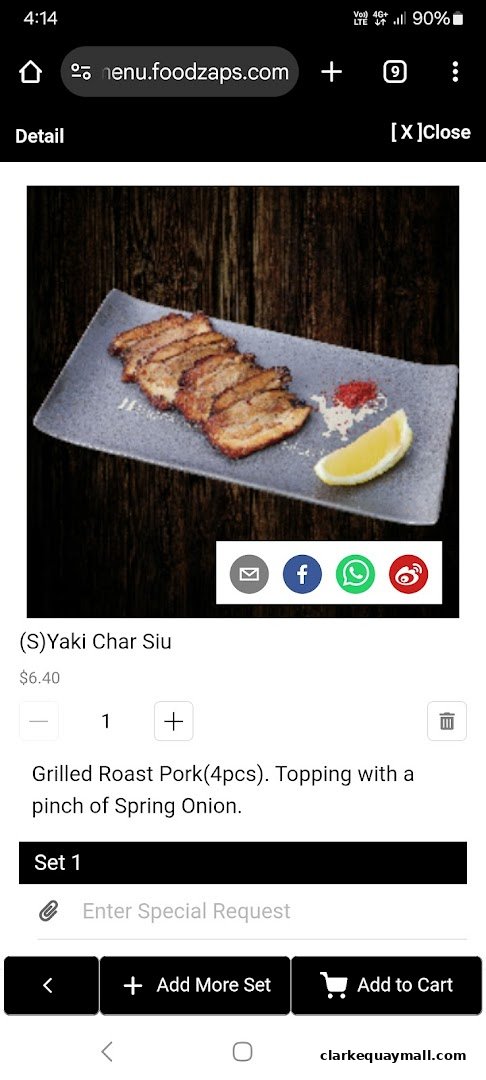 A close-up of a menu item featuring grilled roast pork with lemon and sauce.