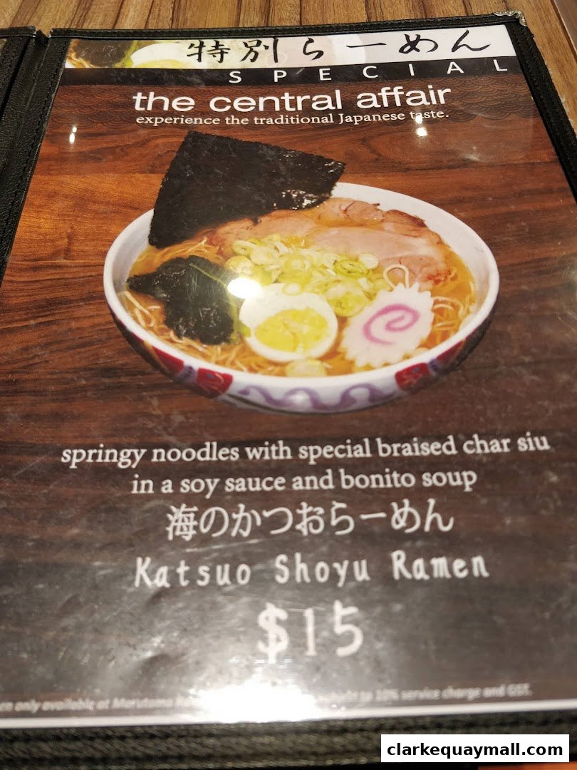 A menu item featuring a bowl of ramen with pork, egg, seaweed, and narutomaki.