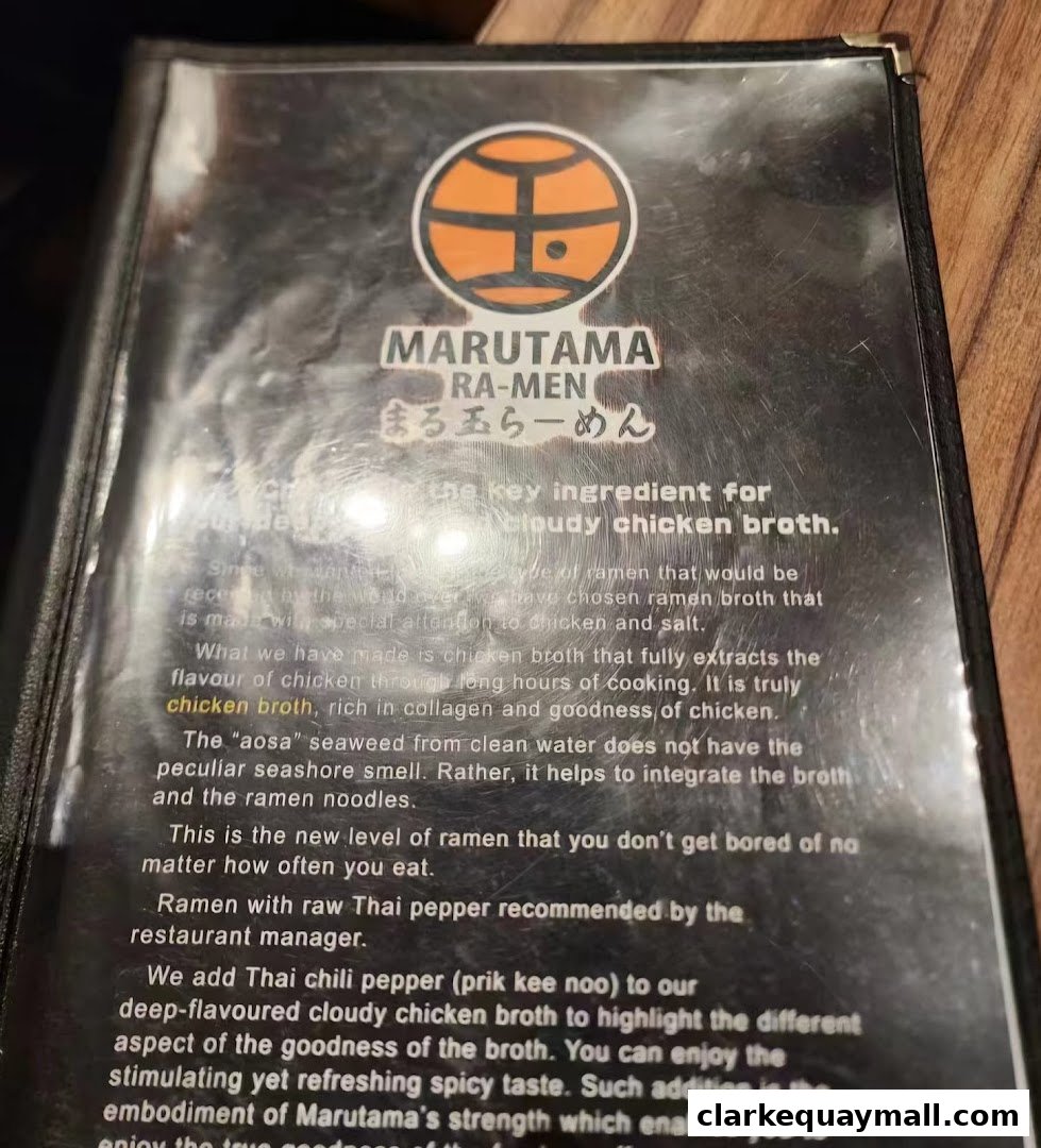 A menu page for Marutama Ramen, detailing their signature cloudy chicken broth.
