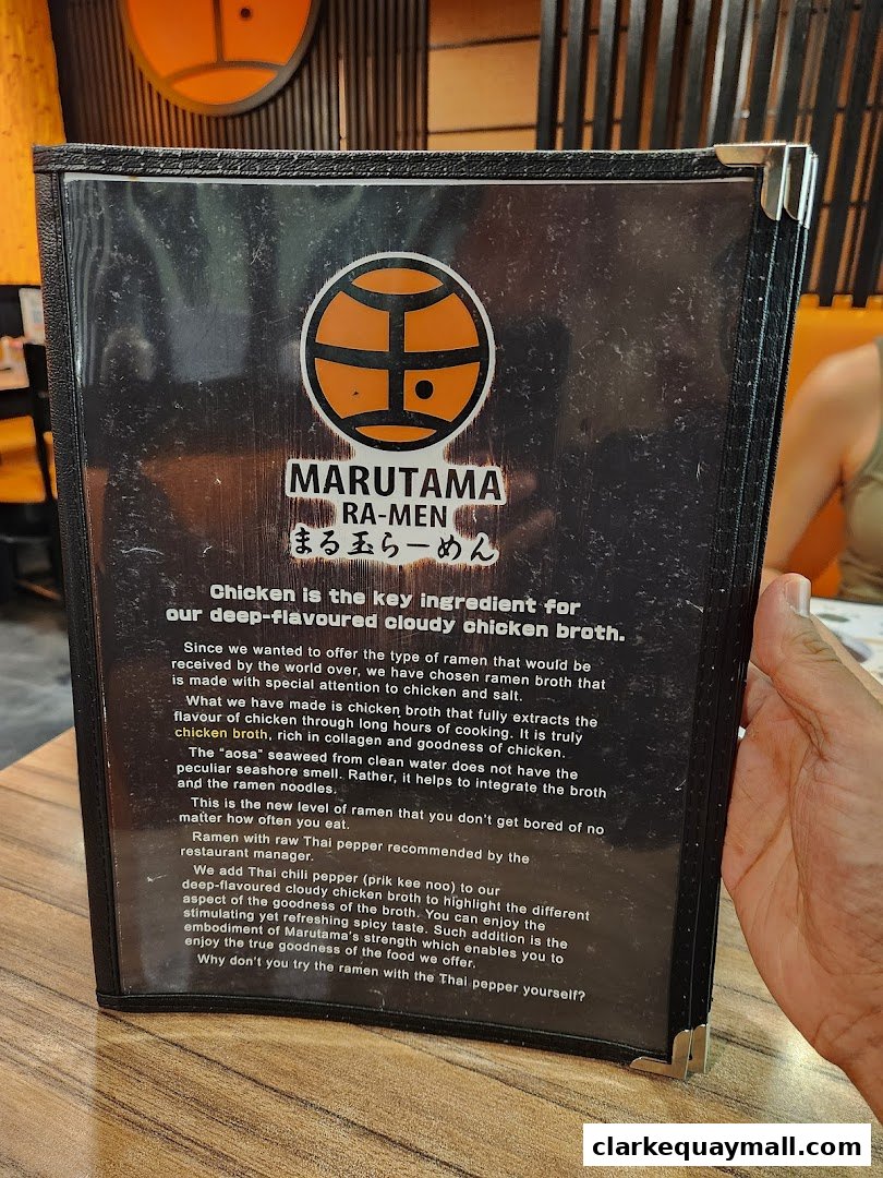 A menu from Marutama Ramen featuring their signature cloudy chicken broth.