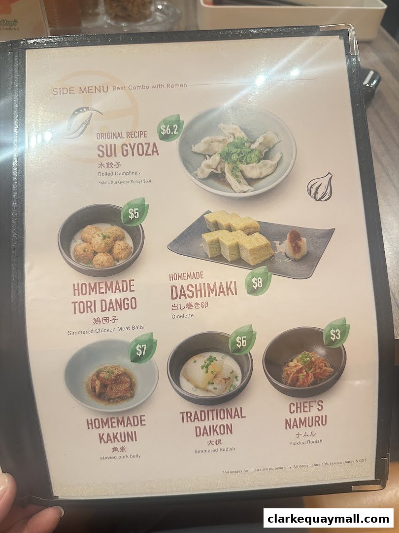 A menu featuring various side dishes for ramen, including dumplings, chicken meatballs, and pickled radish.
