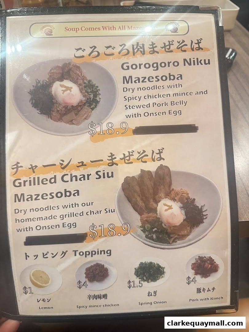 A menu from Marutama Ramen The Central featuring two types of Mazesoba and various toppings.