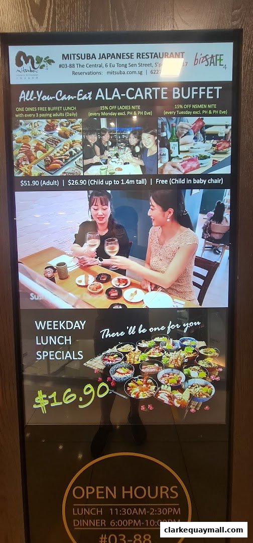 A digital display showcasing Mitsuba Japanese Restaurant's buffet and weekday lunch specials.