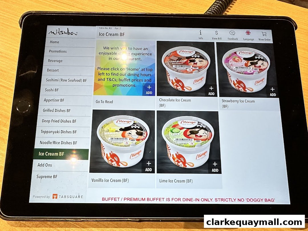 A tablet displaying the menu of Mitsuba Japanese Restaurant, featuring ice cream options.