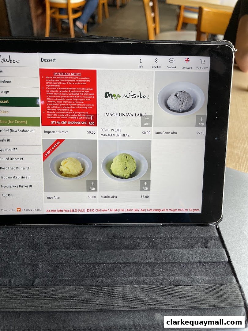 A tablet displays the dessert menu for Mitsuba Japanese Restaurant, featuring ice cream options.