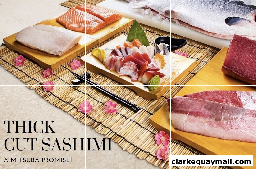 A selection of fresh, thick-cut sashimi and whole fish, artfully arranged.
