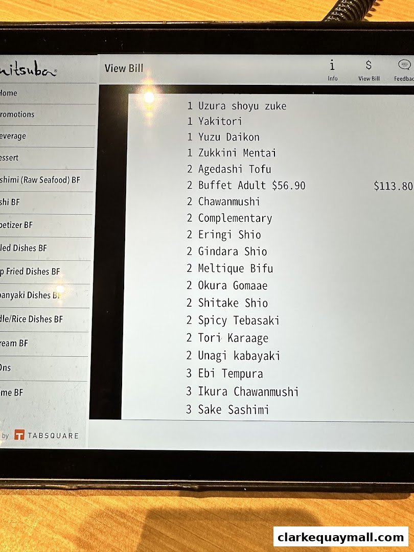 A digital menu displaying a list of Japanese dishes and their prices at Mitsuba.