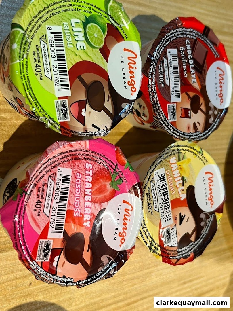 Four cups of Mingo ice cream in different flavors: Lime, Chocolate, Strawberry, and Vanilla.