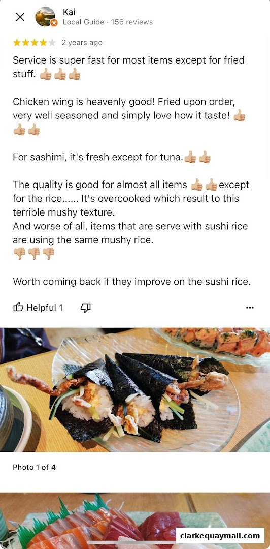 A customer review of Mitsuba Japanese Restaurant with photos of sushi and sashimi.