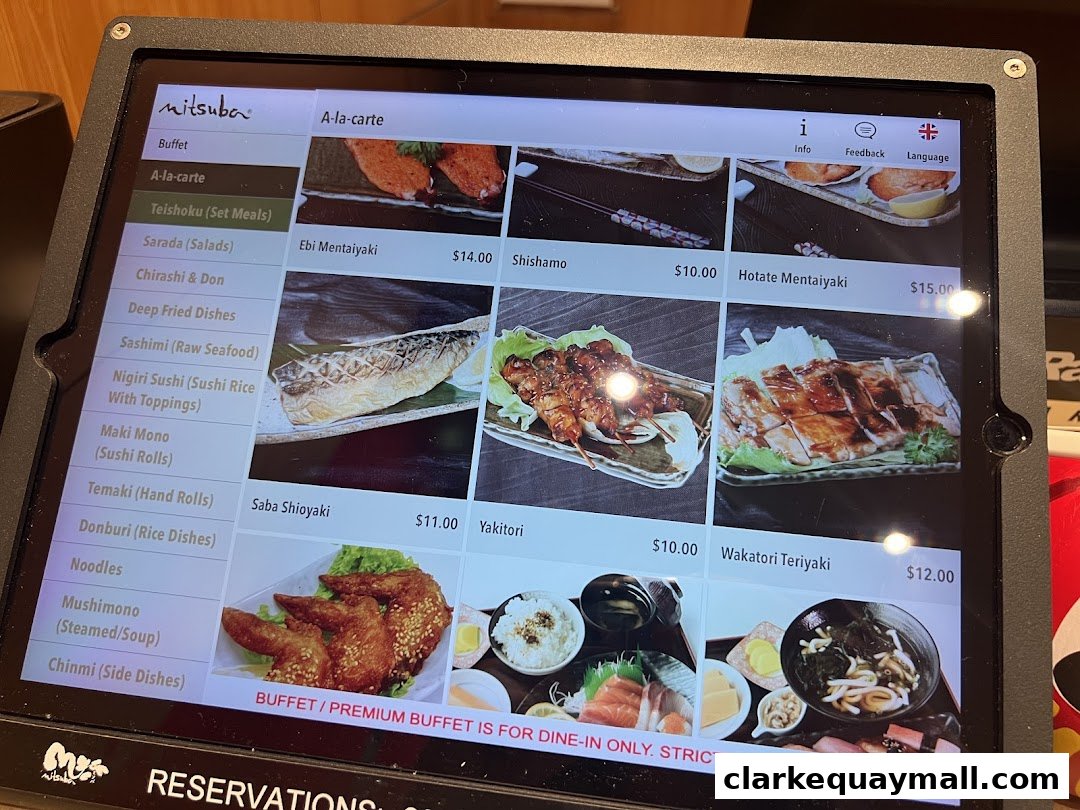 A digital menu displaying various Japanese dishes with images and prices.