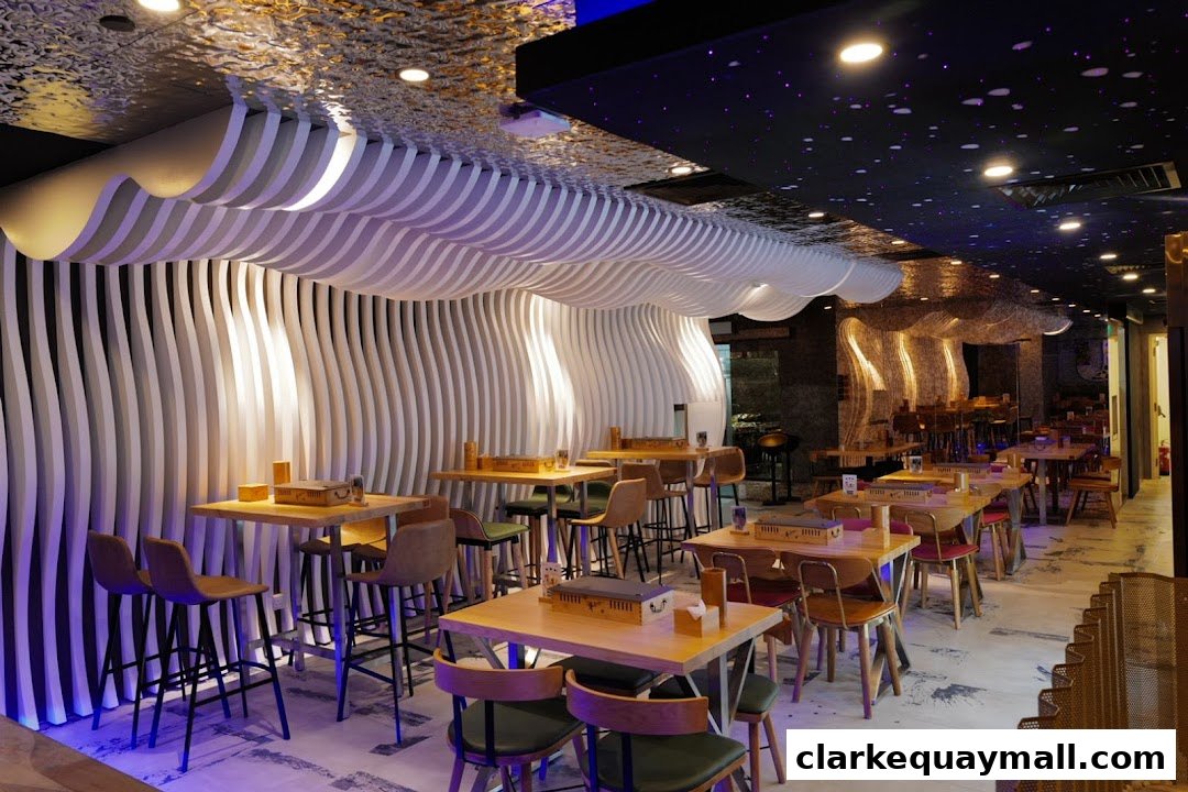 Interior of a modern restaurant with unique wavy wall design and starry ceiling.