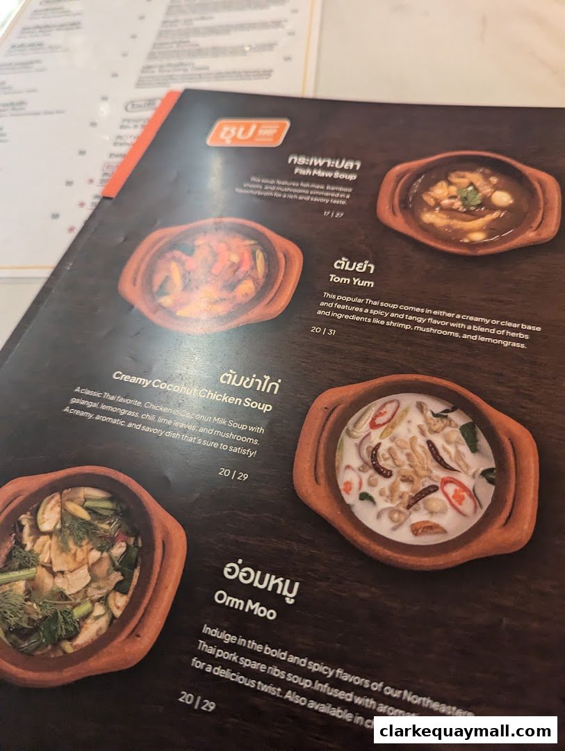 A menu page showcasing various Thai soups with enticing images and descriptions.