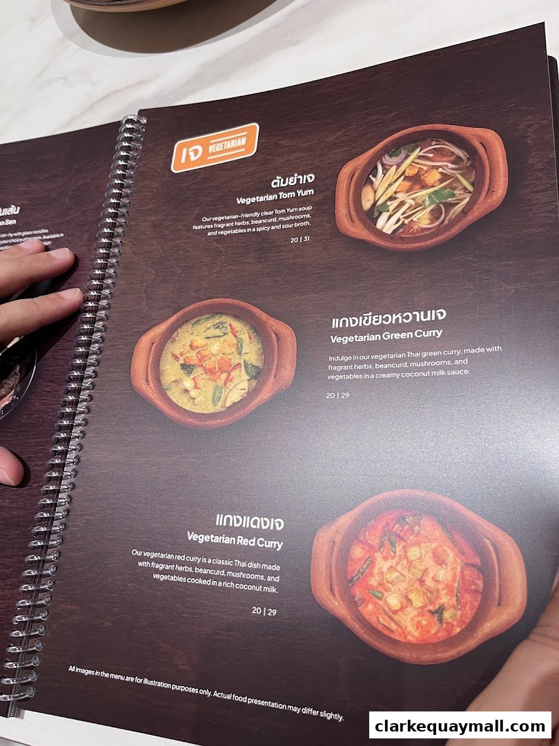 A menu page showcasing three vegetarian Thai dishes with descriptions and prices.