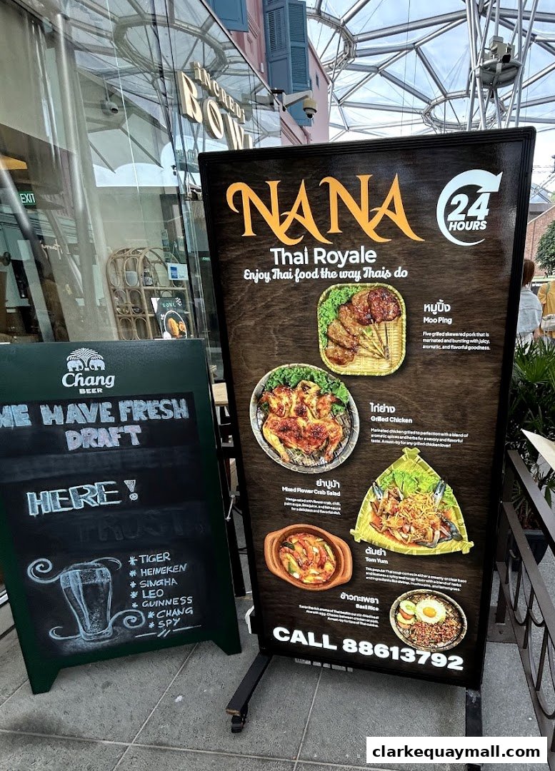 A sign for Nana Thai Royale restaurant showcasing popular Thai dishes and a chalkboard advertising fresh draft beer.