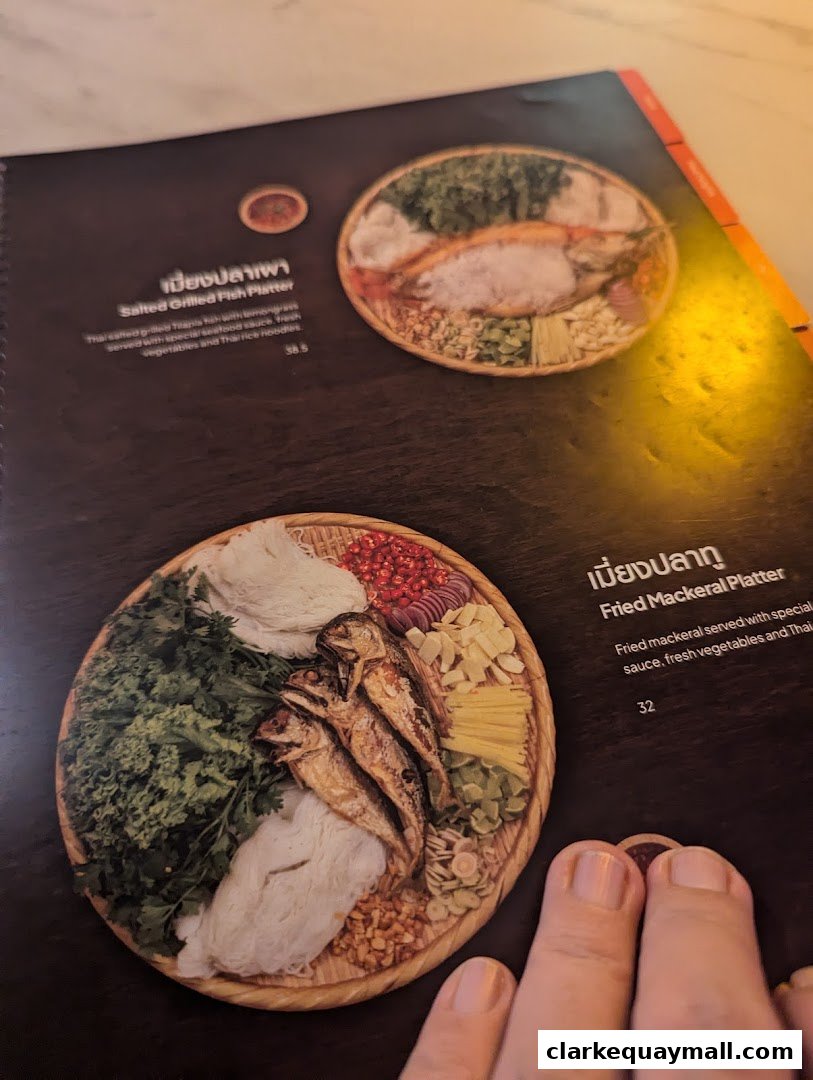 A menu from Nana Thai Royale Clarke Quay featuring two Thai platters with descriptions and prices.
