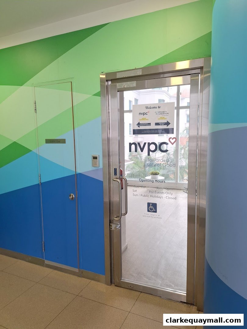 Entrance to the National Volunteer Philanthropy Centre with its logo and opening hours displayed.
