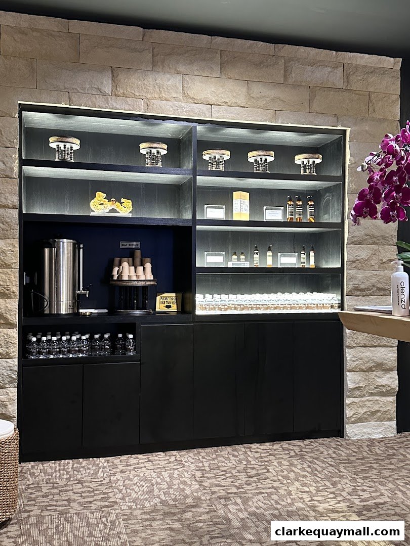 A well-lit display cabinet with various products and a self-service beverage station.