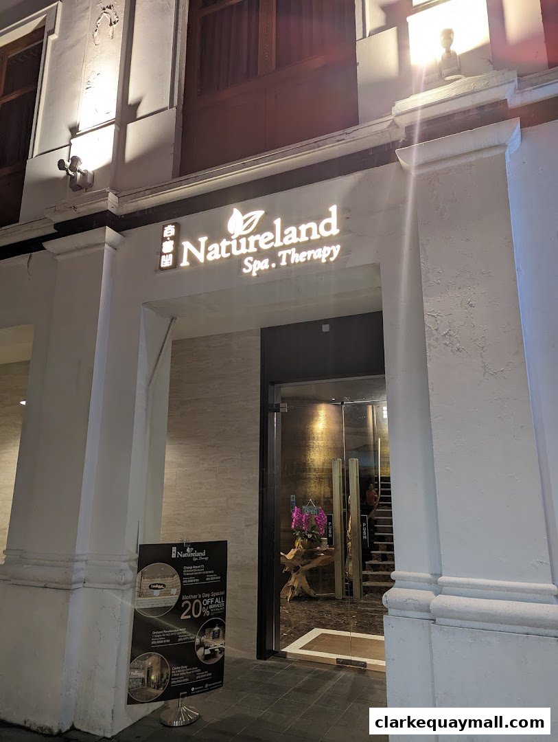 The entrance of Natureland Spa. Therapy with a promotional poster outside.