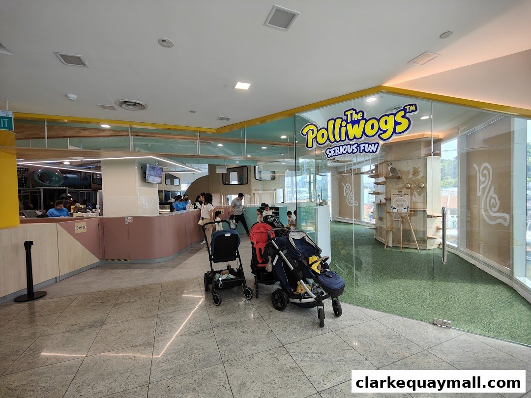 Interior view of Nekoland By The Polliwogs, a play area with strollers and a reception counter.