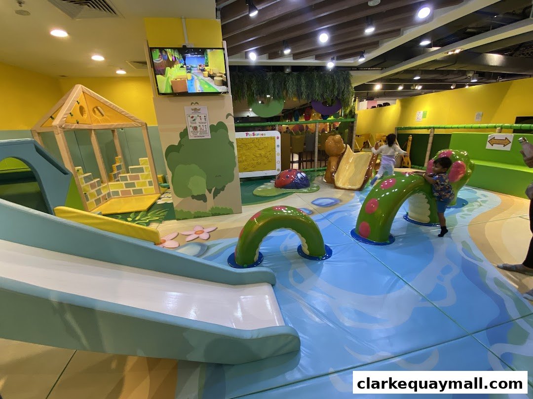 A vibrant indoor playground with slides, climbing structures, and soft play areas for children.