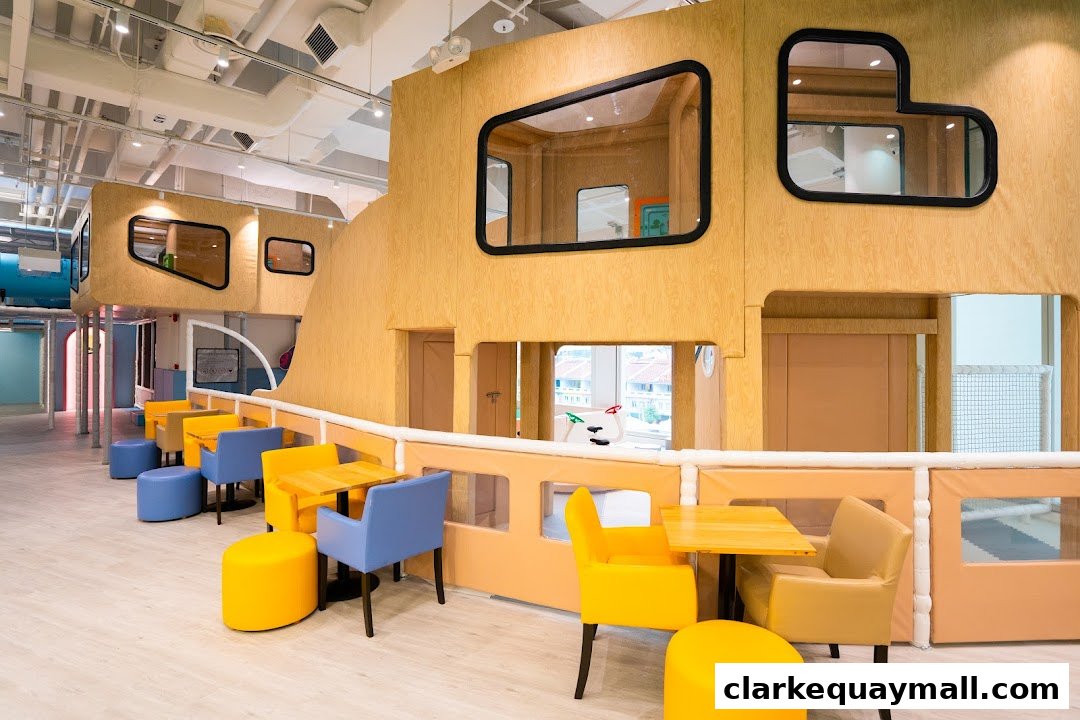 Interior of a colorful children's play area with seating and play structures.