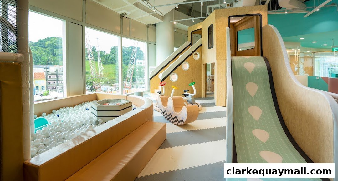 A bright and colorful indoor playground with a ball pit, slides, and play structures.