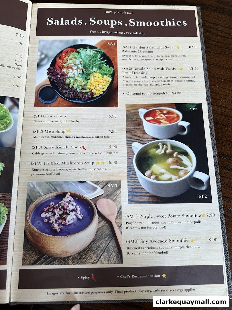 A menu page showcasing plant-based salads, soups, and smoothies with appealing food photography.