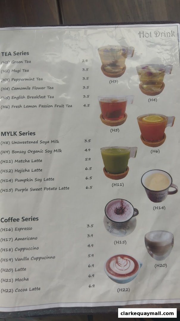A menu from nomVnom Bistro featuring tea, milk, and coffee drinks with prices.