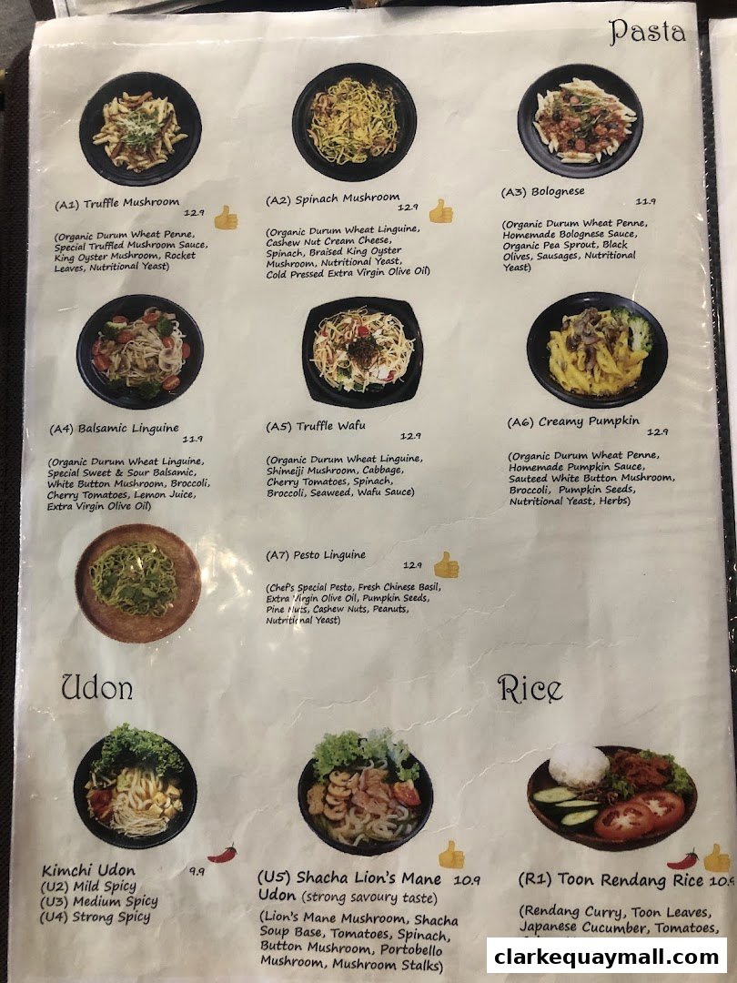 A menu from nomVnom Bistro featuring pasta, udon, and rice dishes with descriptions and prices.