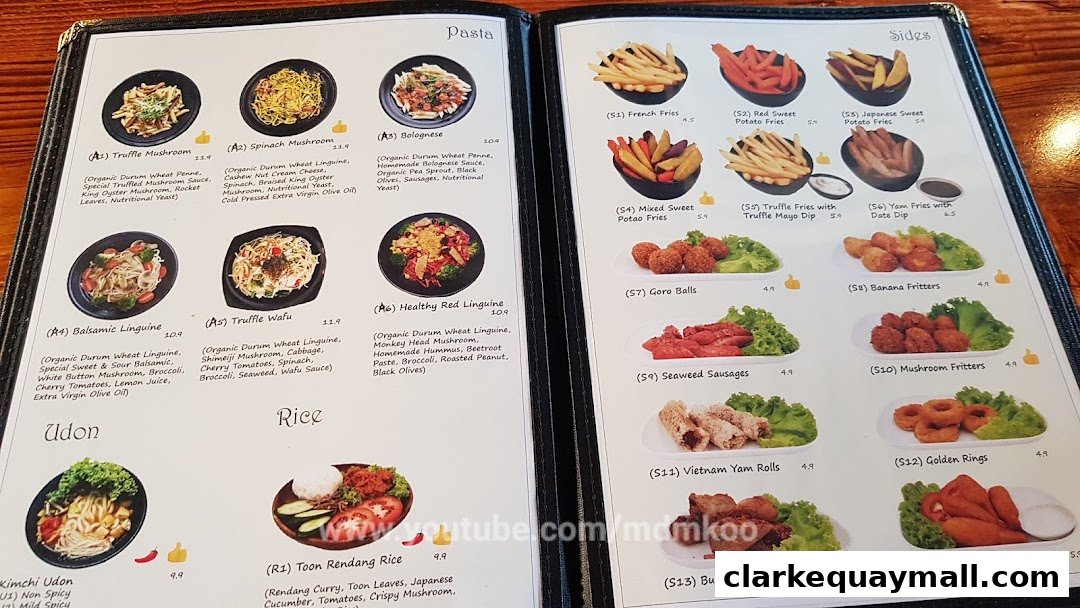 A menu from nomVnom Bistro featuring pasta, udon, rice, and sides with enticing descriptions and prices.