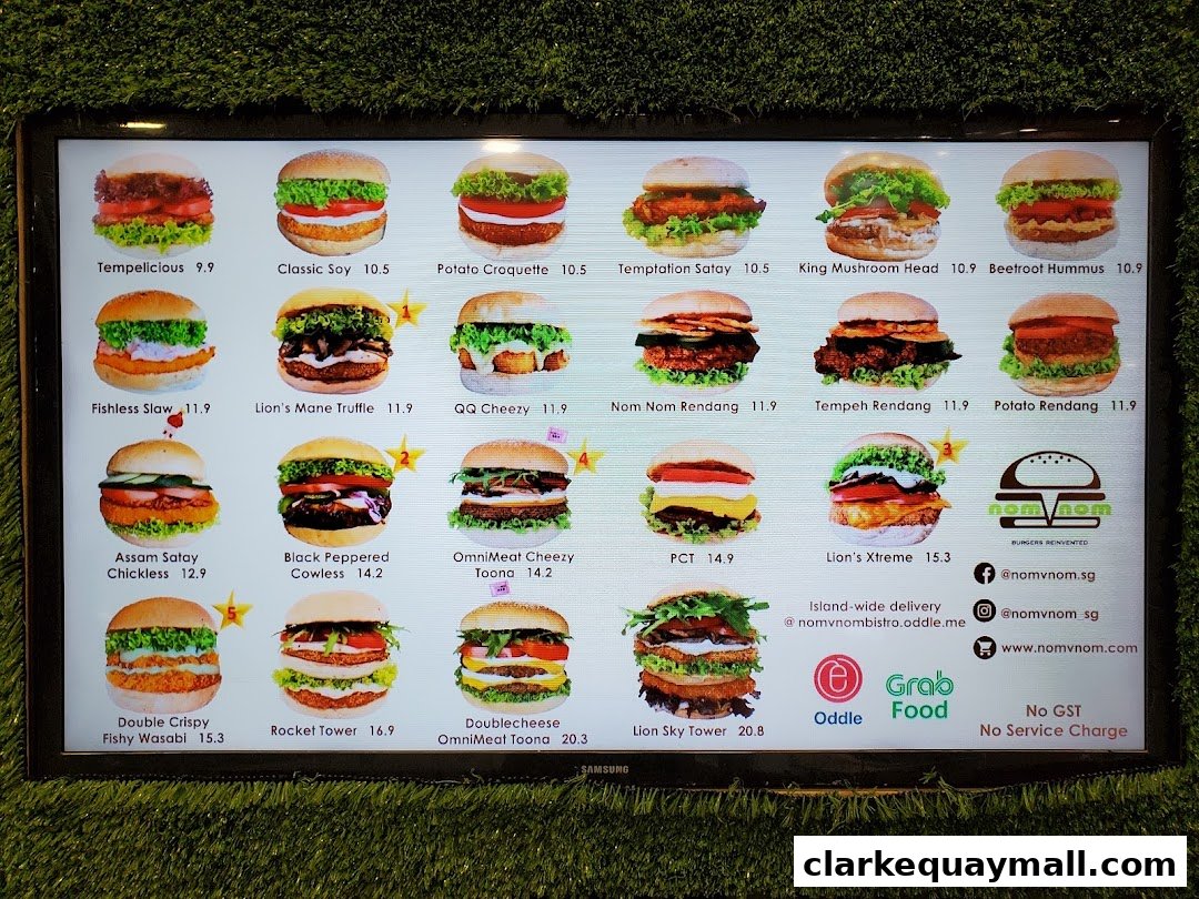 A digital menu board displaying various burgers with their names and prices.