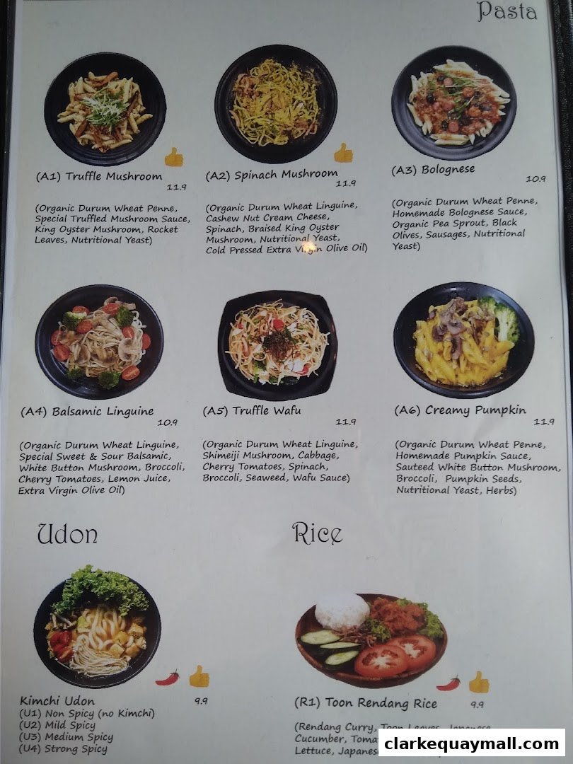 A menu from nomVnom Bistro featuring pasta, udon, and rice dishes with descriptions and prices.