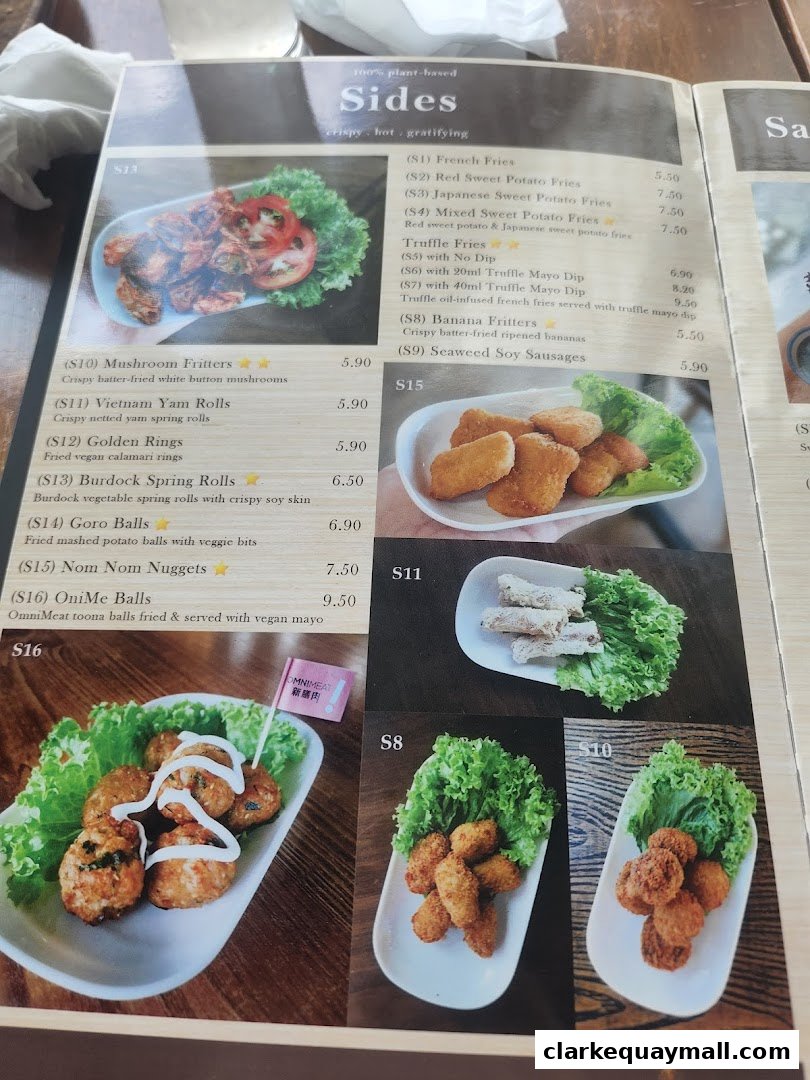 A menu page from nomVnom Bistro showcasing various plant-based side dishes with enticing descriptions and prices.