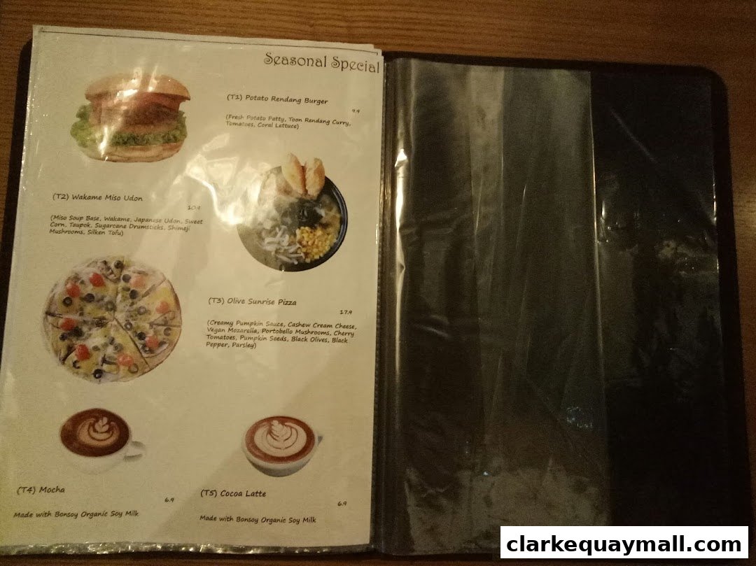 A menu featuring seasonal specials including a burger, udon, pizza, mocha, and cocoa latte.