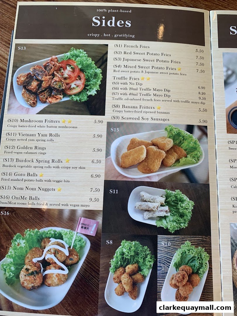 A menu page showcasing various plant-based side dishes with appealing food photography.