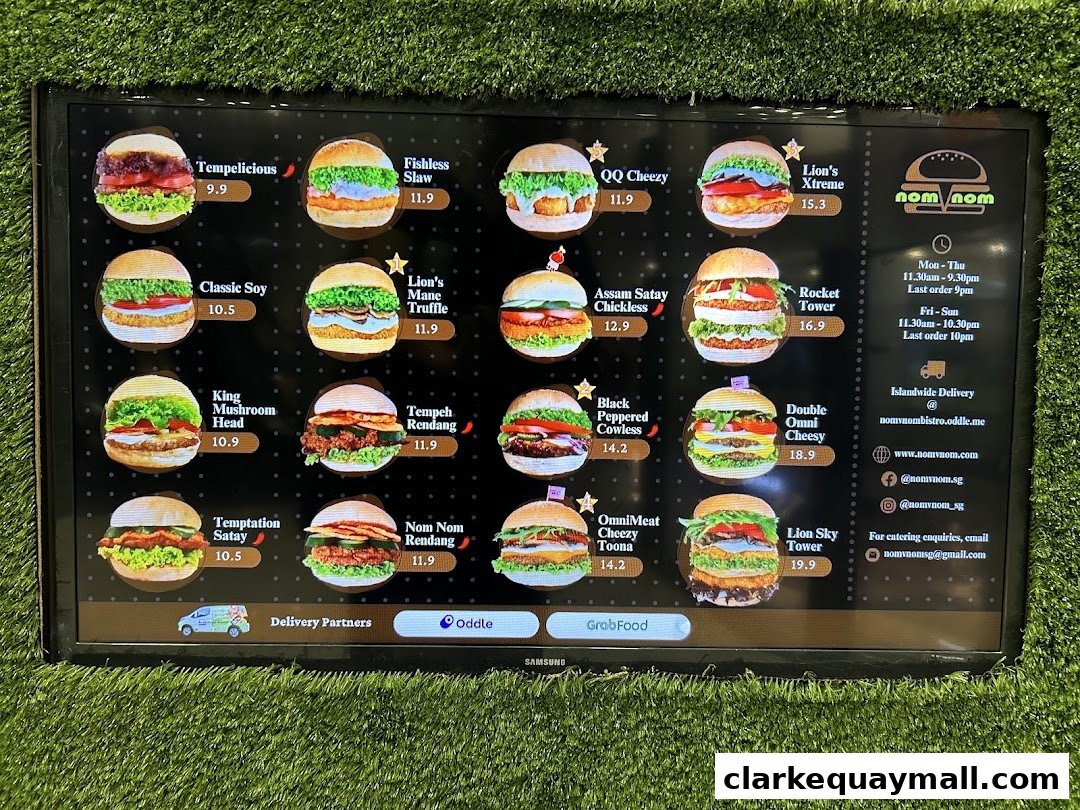 A digital menu displaying various burgers with images and prices from nomVnom Bistro.